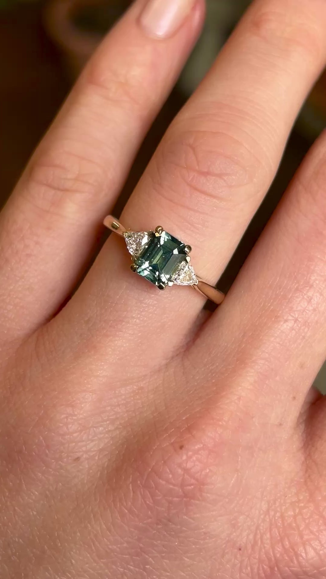 Green sapphire and diamond three-stone engagement ring
