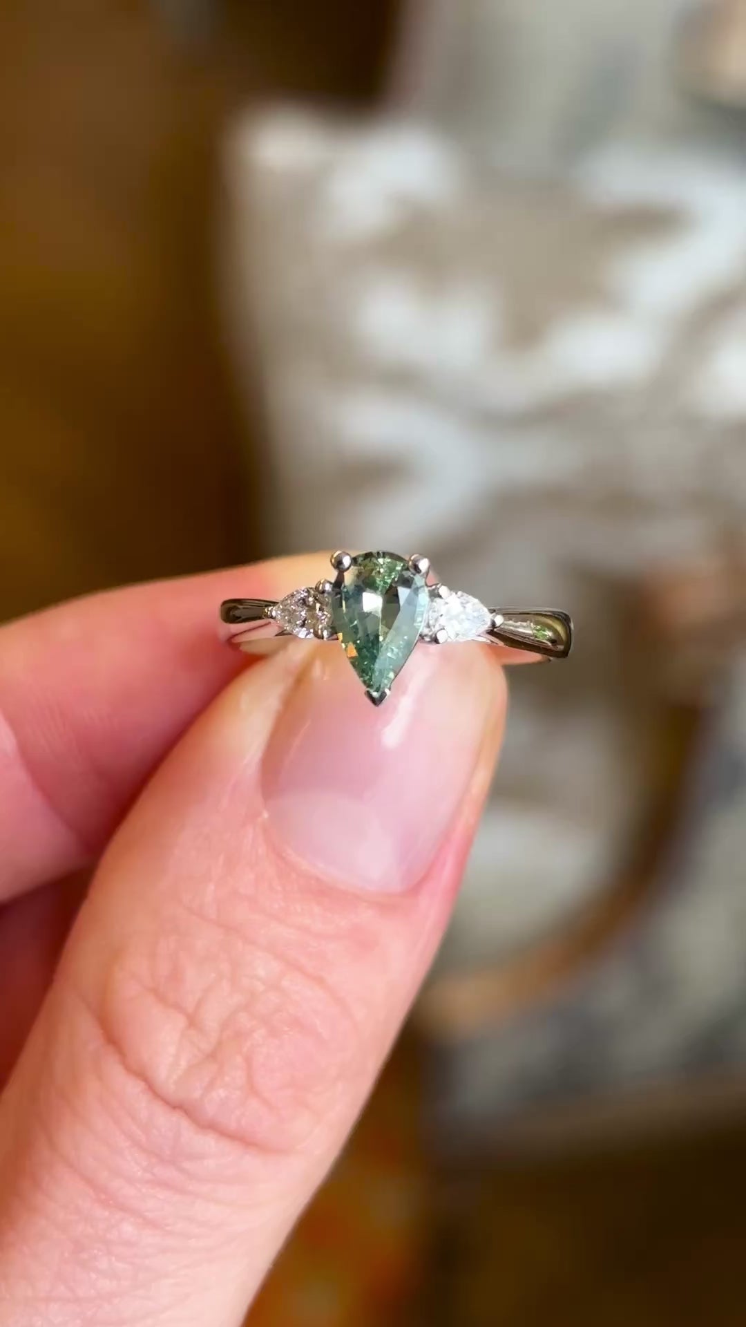 Pear-cut teal sapphire & diamond three-stone engagement ring