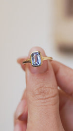 Video presenting the antique-inspired sapphire solitaire balanced on a fingertip for a clear face-on view.