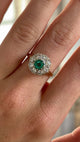 Vintage, 1980s emerald & diamond cluster ring worn on hand.