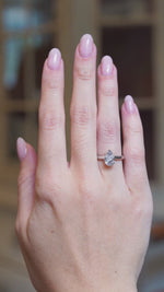 Vintage 1990s salt and pepper diamond solitaire ring worn on hand with slight movements.