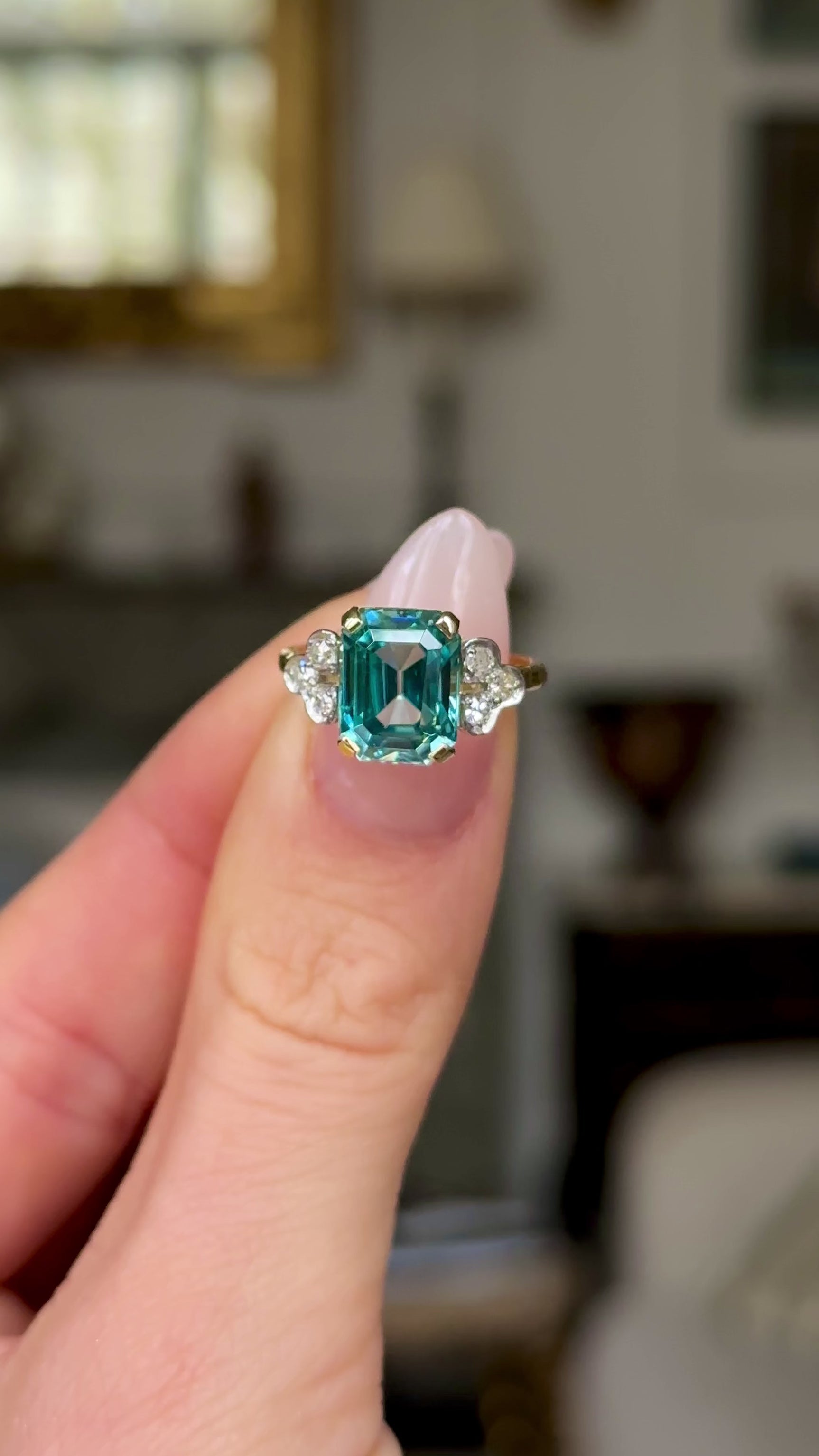 Vintage, Art Deco Aquamarine and Diamond Ring, 18ct White Gold held in fingers and rotated to give perspective.