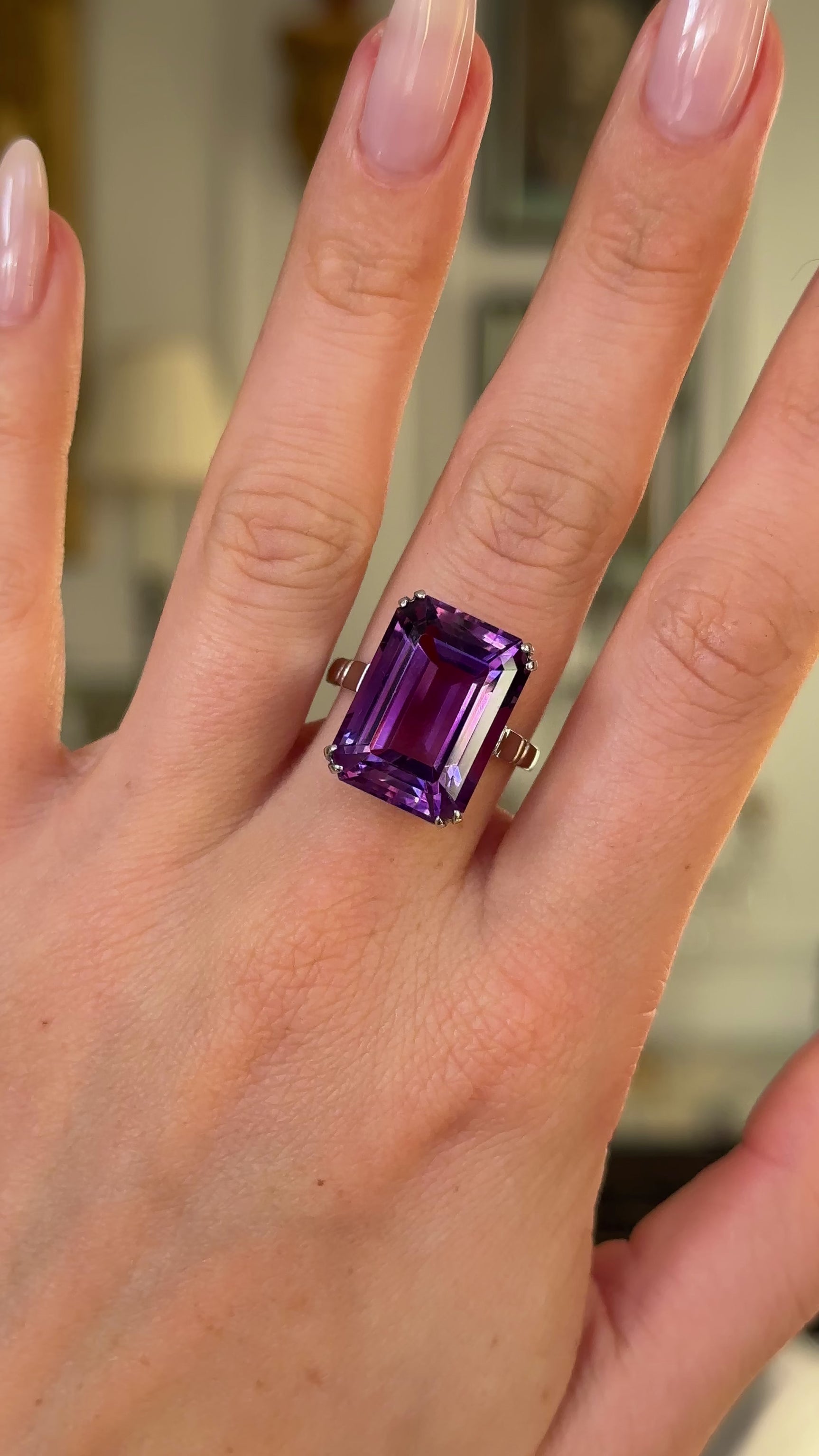 Vintage, Art Deco amethyst cocktail ring worn on hand and moved around to give perspective.