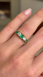 Video of an Antique, Victorian emerald & old-mine diamond five-stone engagement  ring in yellow gold worn on a hand rotated to see the profile