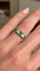 Video of an Antique, Victorian emerald & old-mine diamond five-stone engagement  ring in yellow gold worn on a hand rotated to see the profile