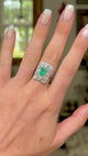Art Deco emerald and diamond panel ring, worn on hand and rotated to give perspective.