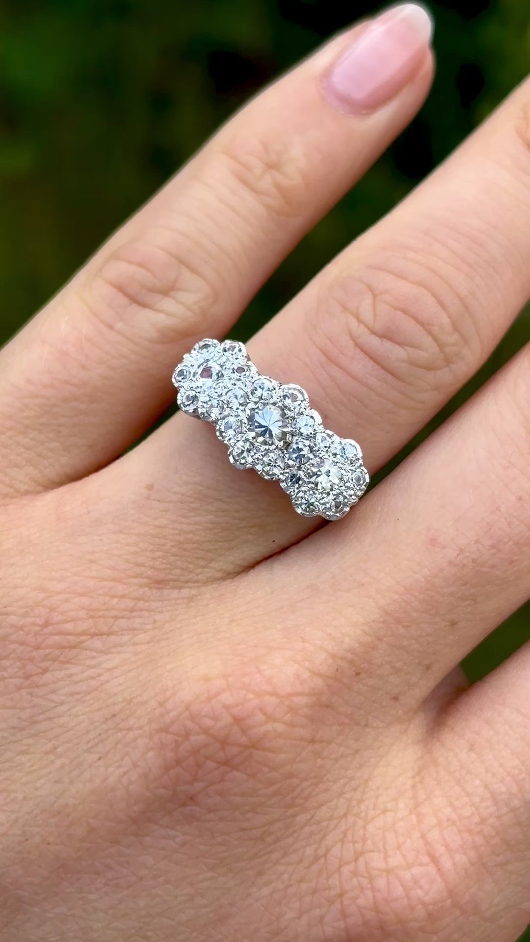 Vintage, 1970s cubic zirconia triple cluster ring on hand