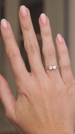 Video showcasing the Art Deco platinum toi et moi ring on the hand, with both transition-cut diamonds catching the light.