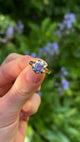 Vintage, Single Stone 2.76ct Cornflower Blue Sapphire, 14ct Yellow Gold held in fingers.