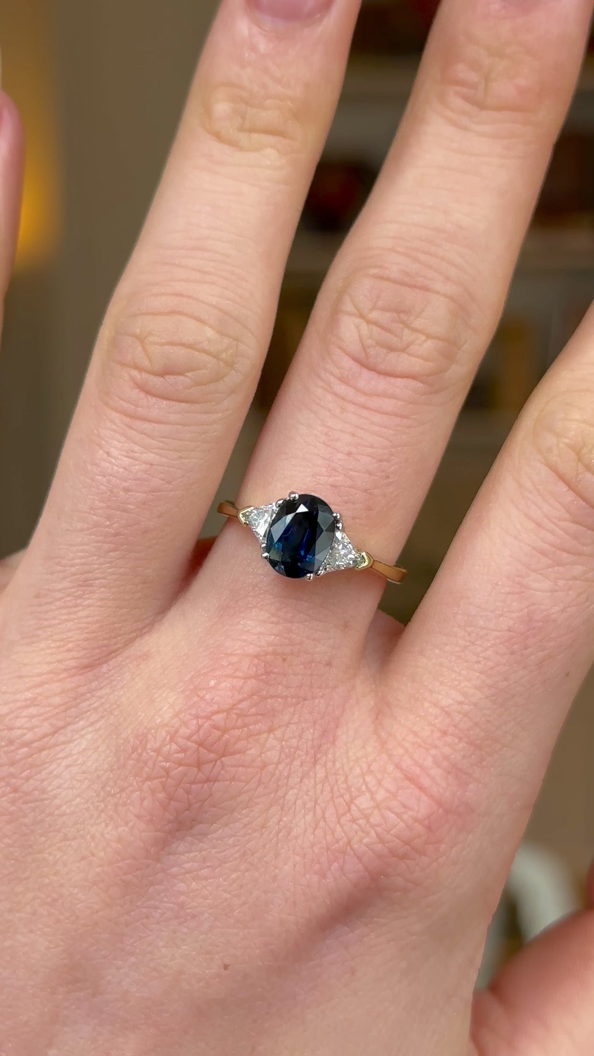 Vintage, Sapphire and Diamond Three-Stone Engagement Ring, 18ct Yellow and White Gold worn on hand and rotated to give perspective.