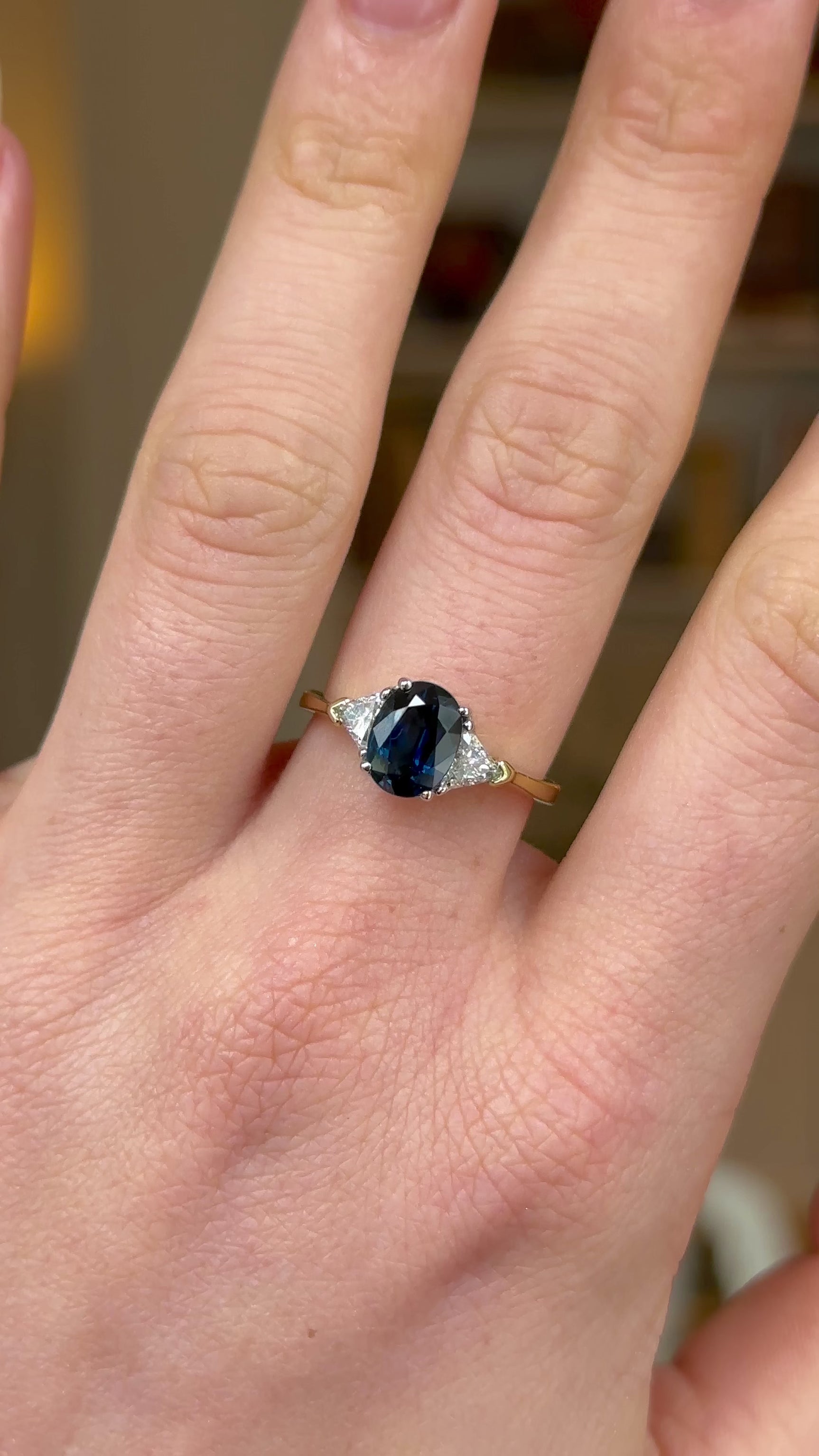 Vintage, Sapphire and Diamond Three-Stone Engagement Ring, 18ct Yellow and White Gold worn on hand and rotated to give perspective.