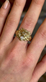 Vintage 1950s old-cut diamond lion’s head ring with diamond-set eyes worn on hand and moved backwards. 