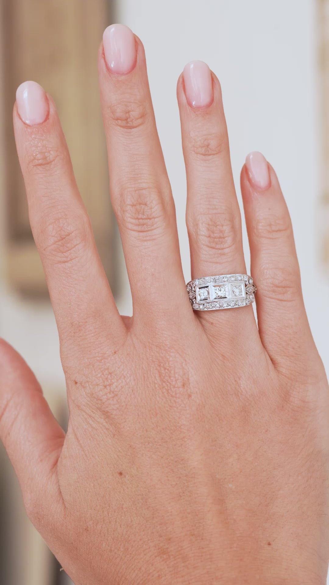 Video of the antique Art Deco diamond ring worn on the hand, capturing its sparkle, scale and geometric character.