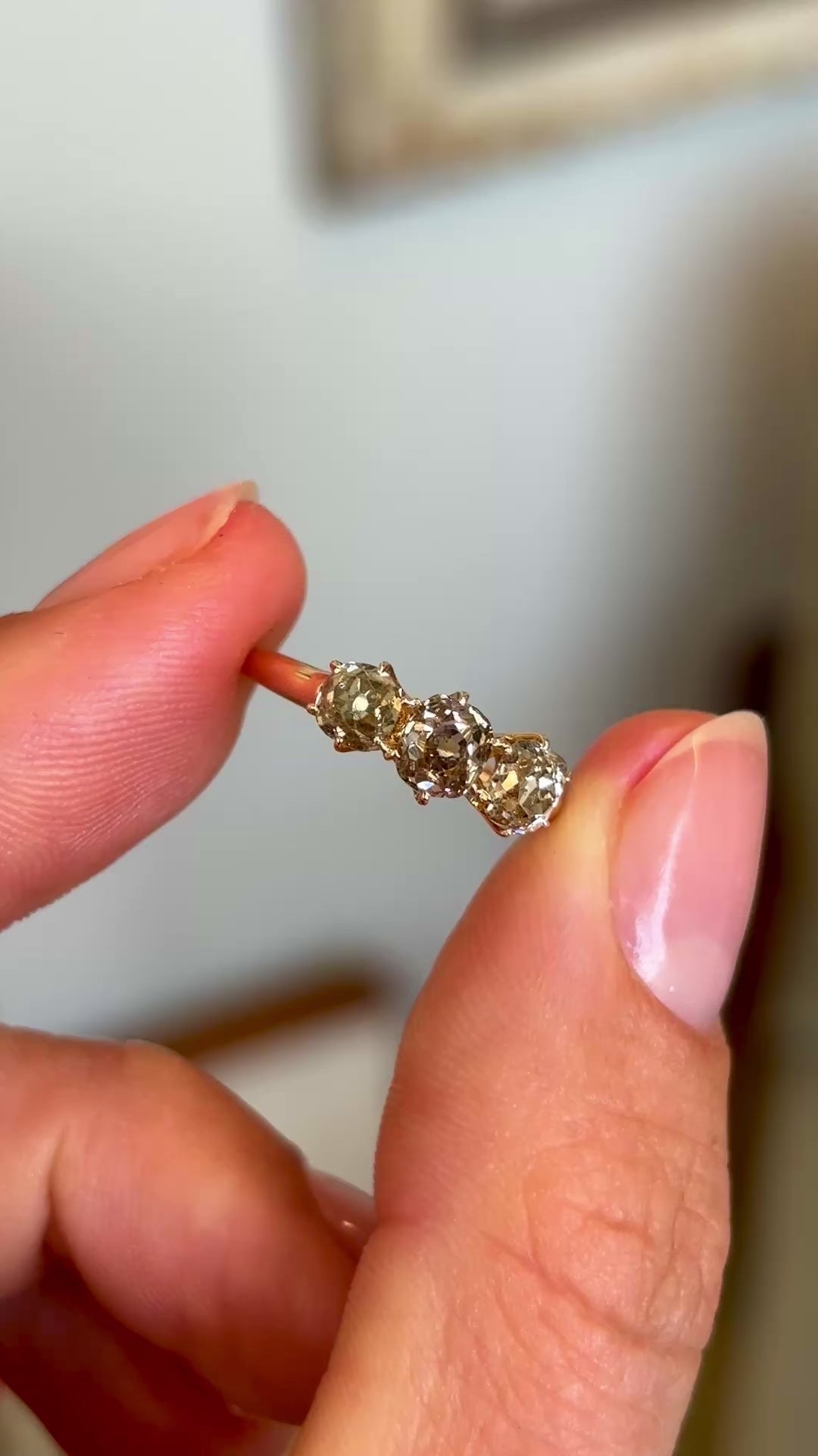 Antique, old-cut yellow-brown diamond three-stone ring