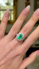 Vintage emerald and diamond cluster ring, worn on hand and moved around to give perspective.