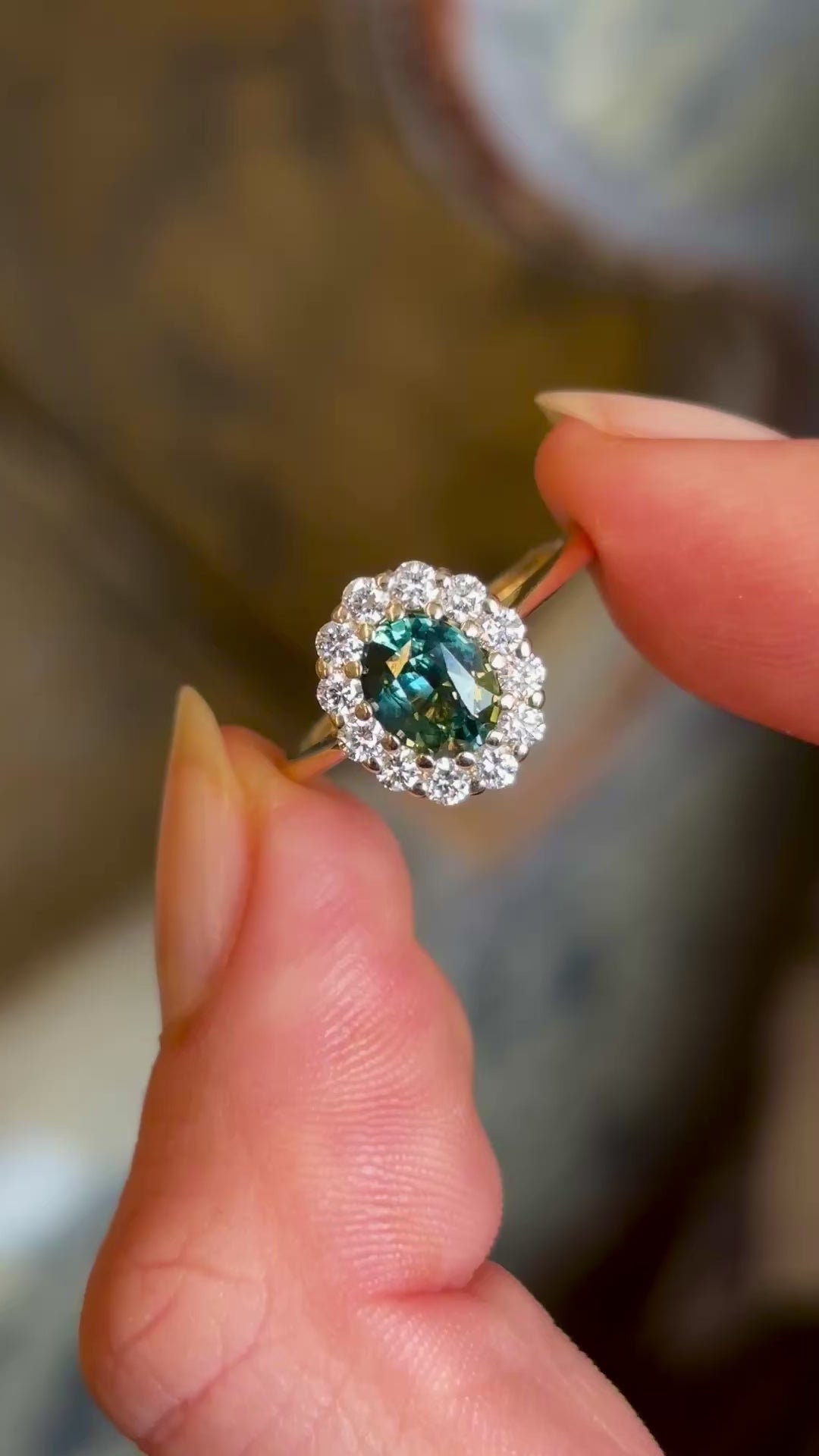Green sapphire and diamond cluster engagement ring