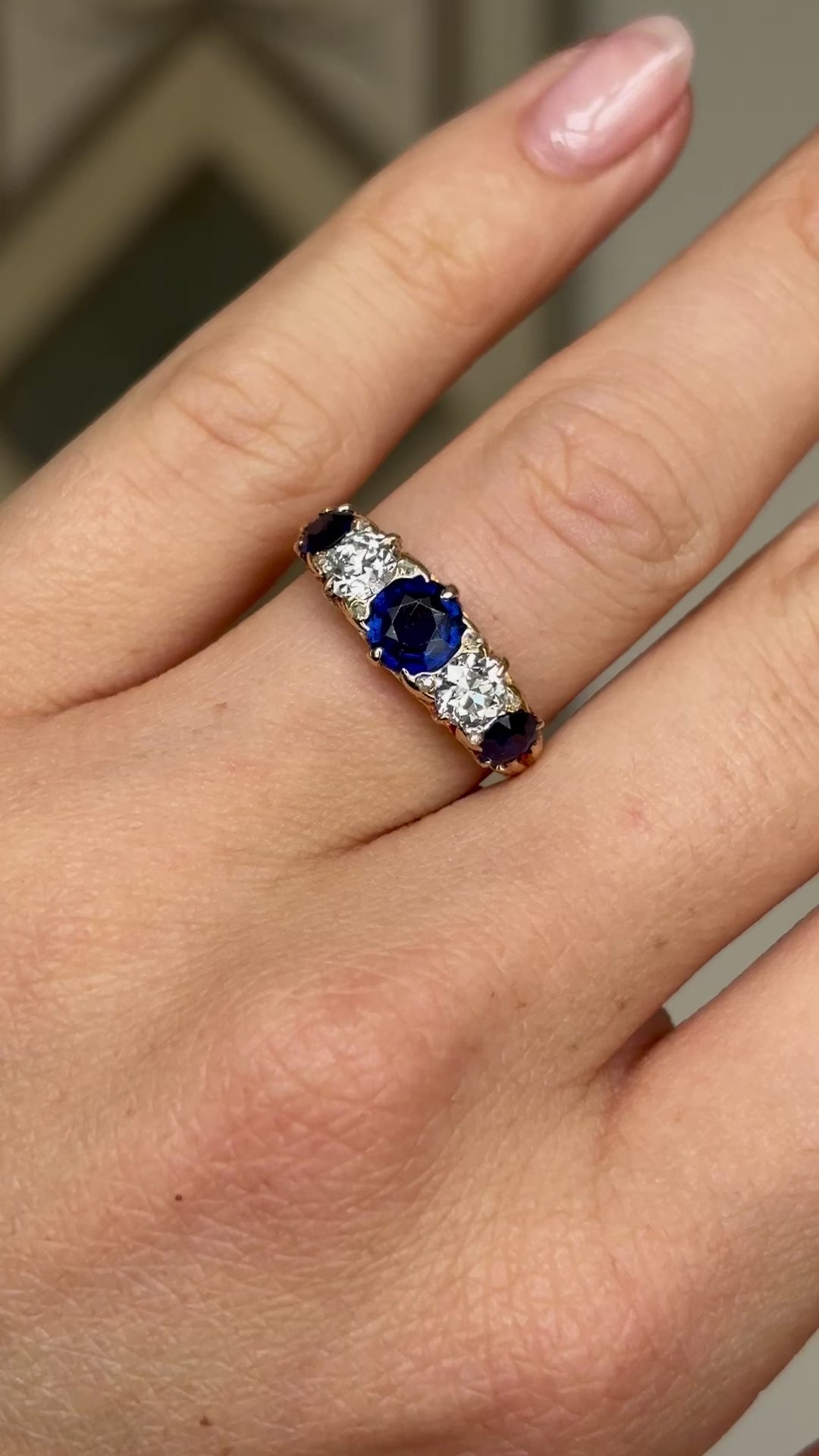 Antique, Victorian sapphire and diamond five-stone ring worn on hand