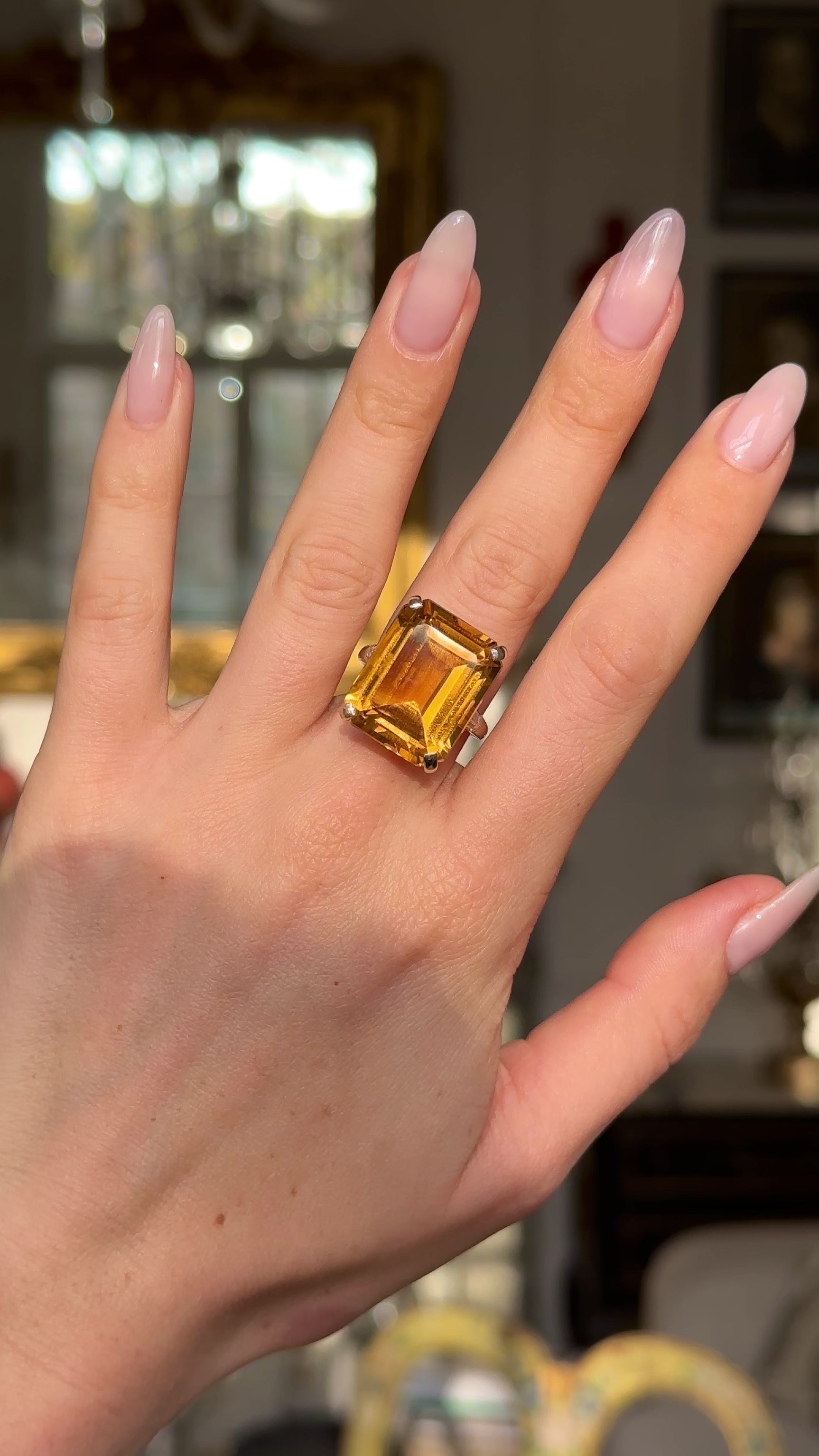 vintage cartier citrine cocktail ring worn on hand and moved around to give perspective.