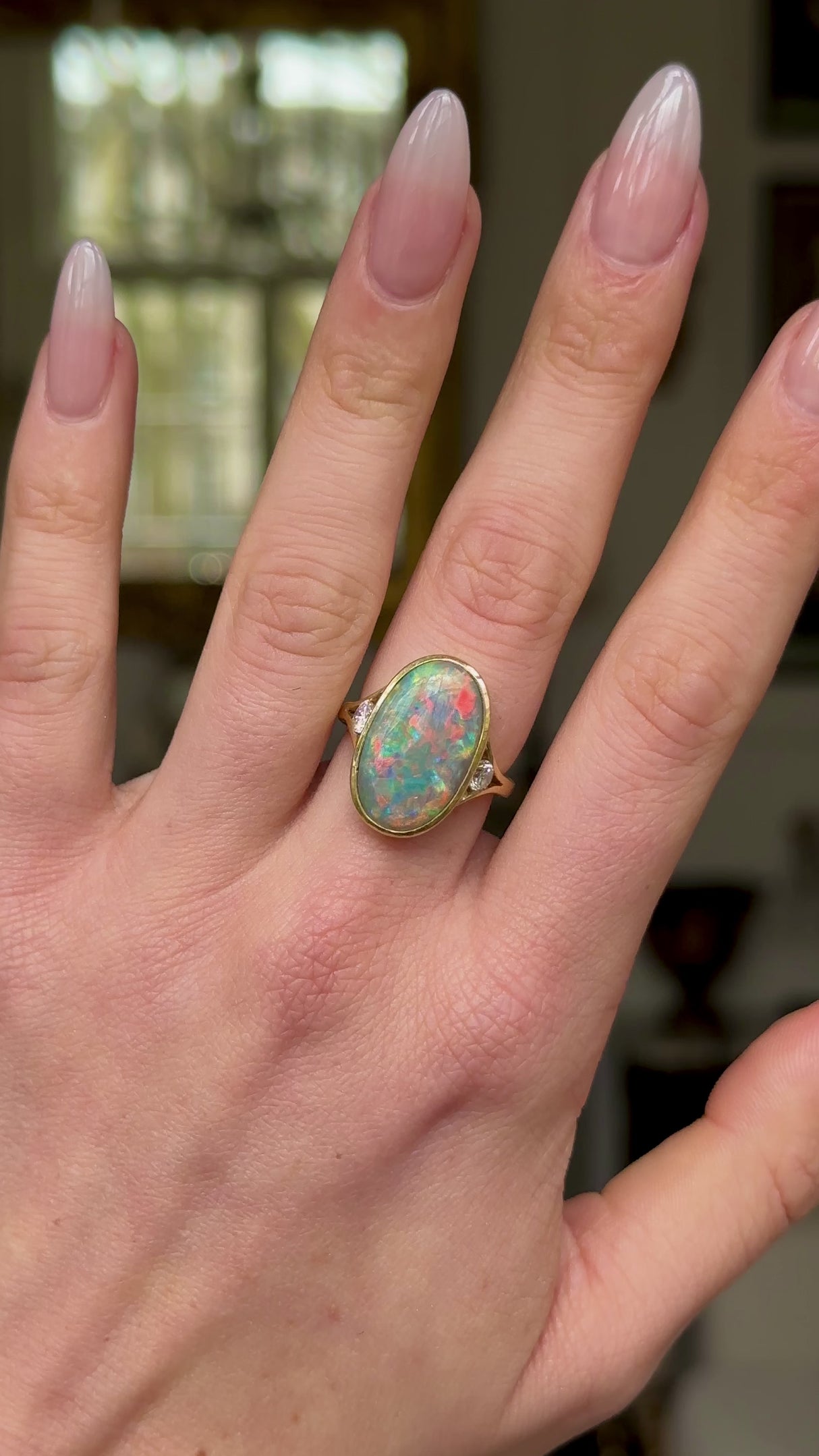 Contemporary, Black Opal and Diamond Cocktail Ring, worn on hand and moved around to give perspective.