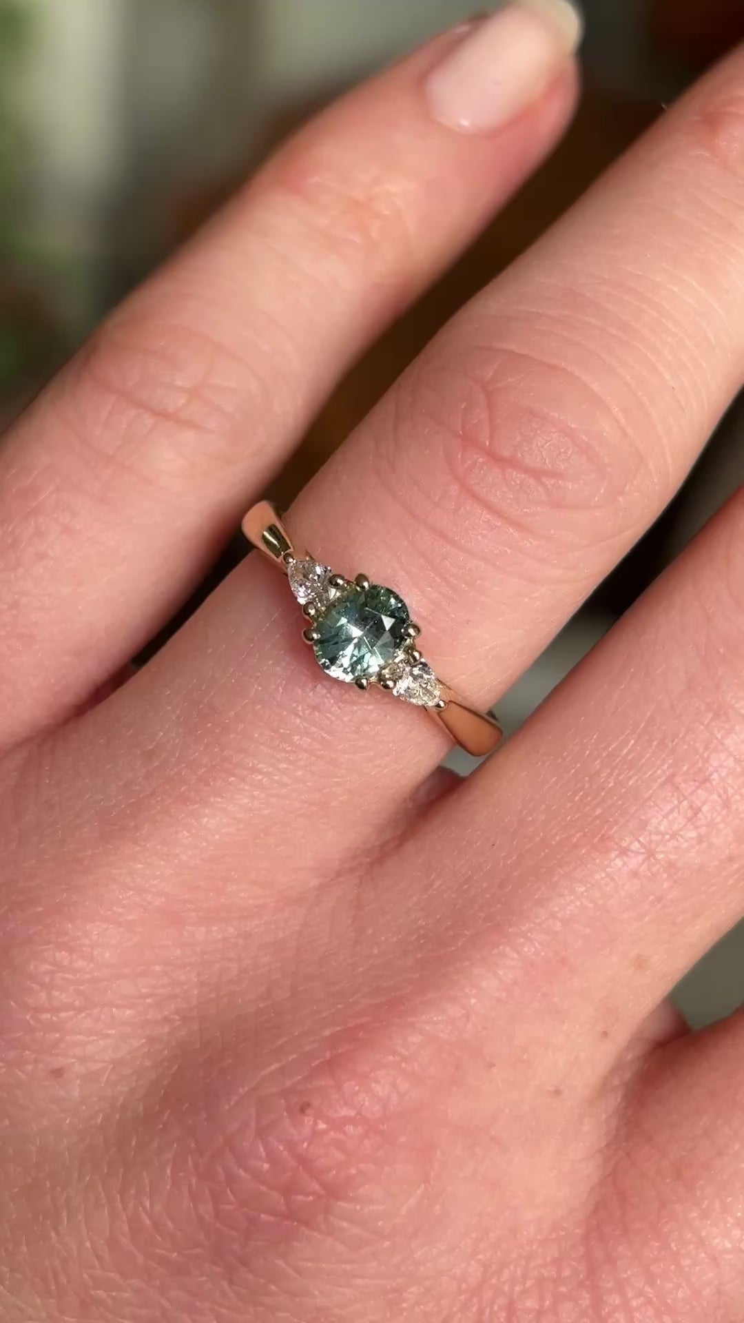 Teal sapphire and diamond three-stone engagement ring