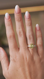 Video of a vintage green beryl and diamond ring worn on the hand, highlighting the sparkle and proportions of the oval-cut gemstone.