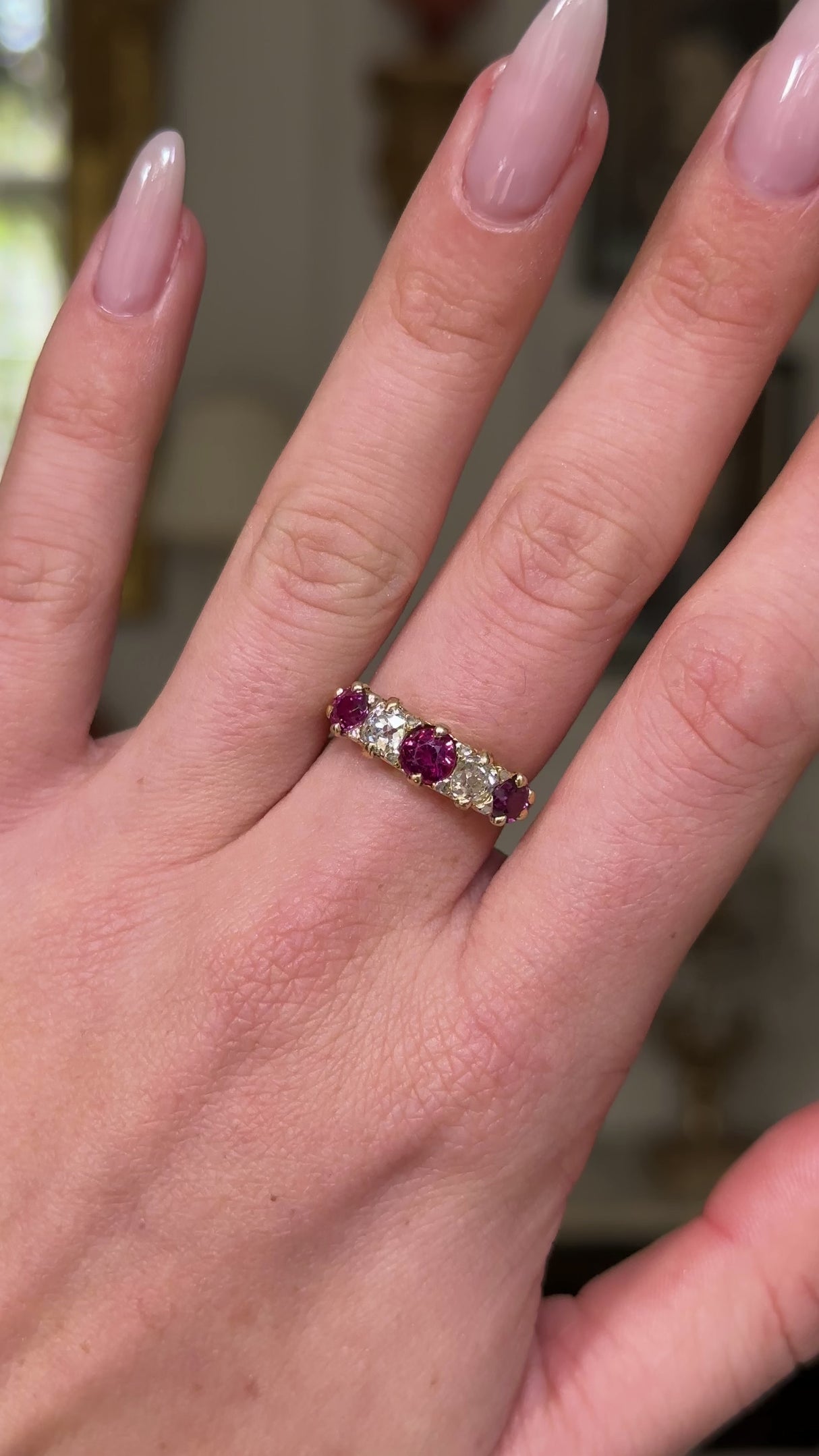 Antique, Edwardian five stone ruby and diamond ring, worn on hand and moved around to give perspective.