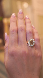 Vintage 1980s fancy coloured brown diamond cluster cocktail ring worn on the hand showing the sparkle of the diamonds in subtle motion.
