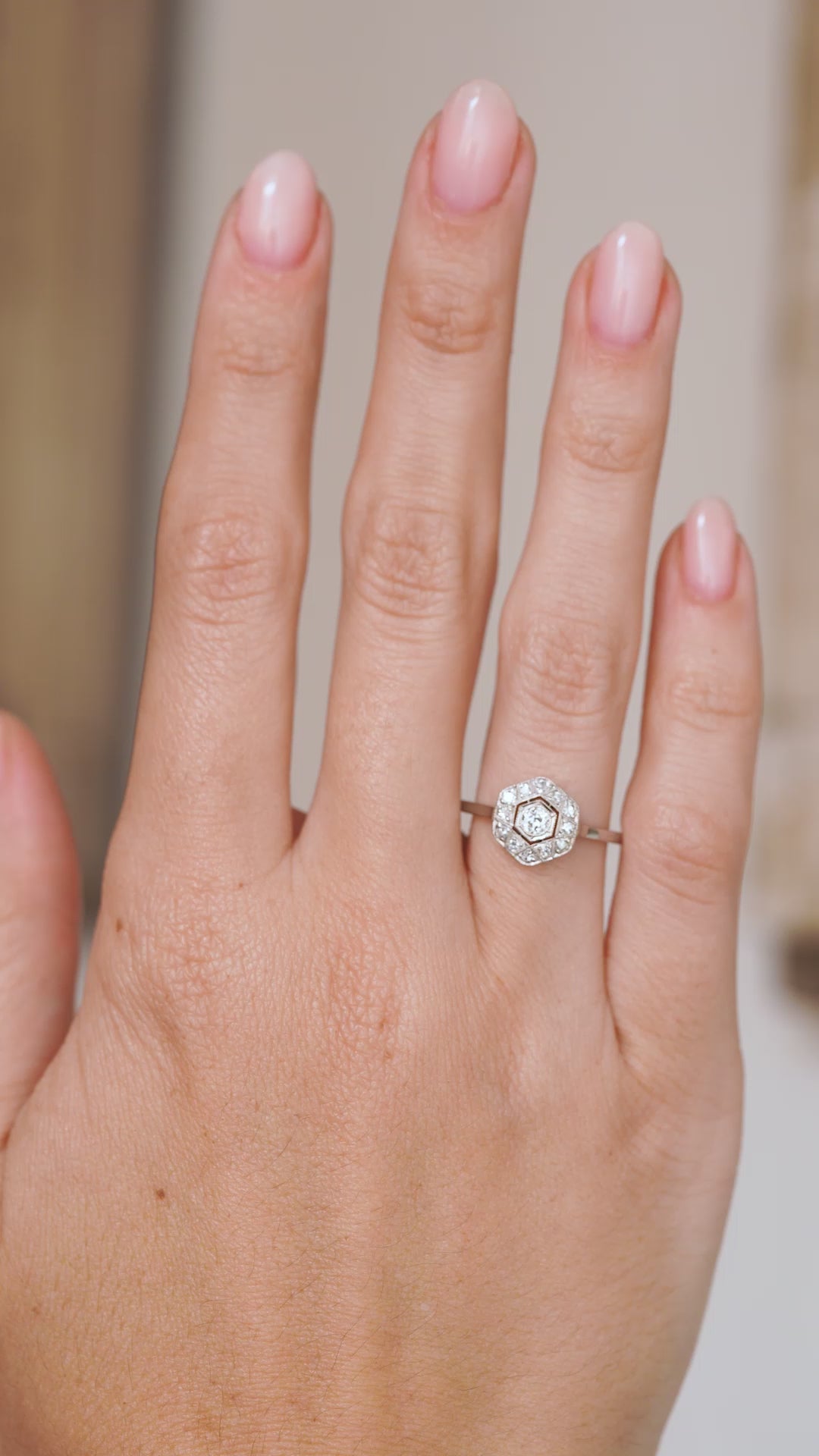 Video of the antique diamond cluster ring worn on the hand, capturing its geometric symmetry and vintage sparkle.
