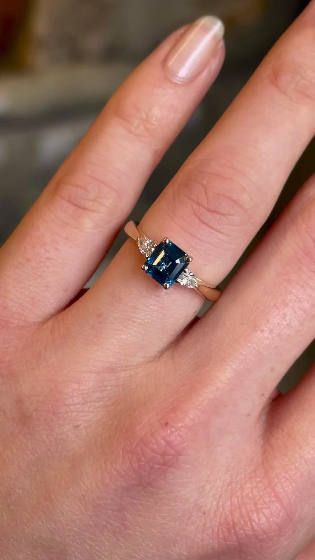 Teal sapphire and diamond three-stone engagement ring