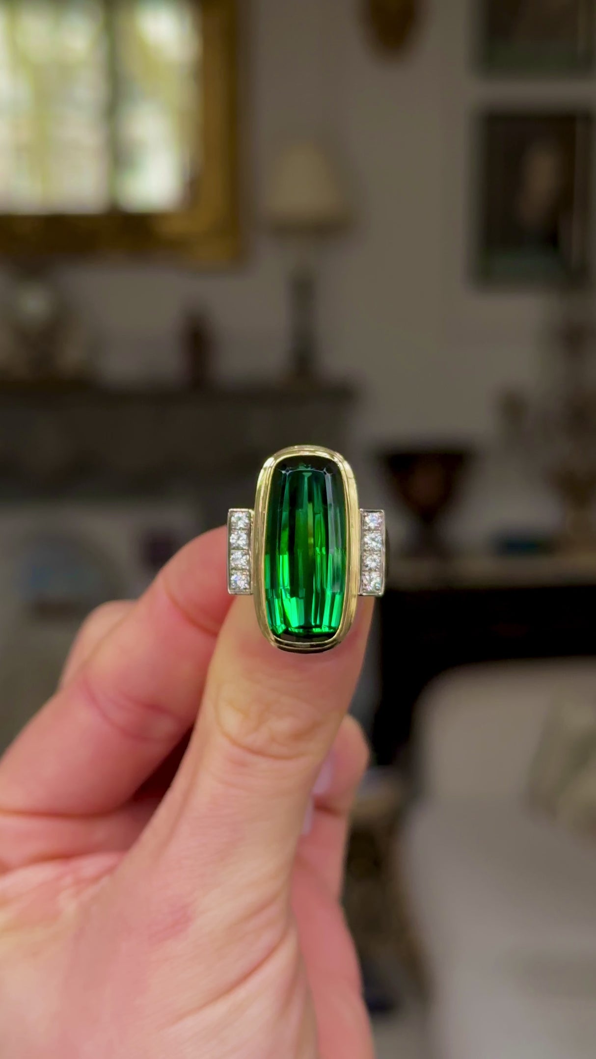 Vintage, Tourmaline and Diamond Cocktail Ring, held in fingers and rotated to give perspective.
