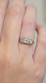 A Video of an Antique three-stone diamond engagement ring worn on the hand