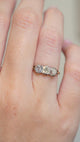 A Video of an Antique three-stone diamond engagement ring worn on the hand
