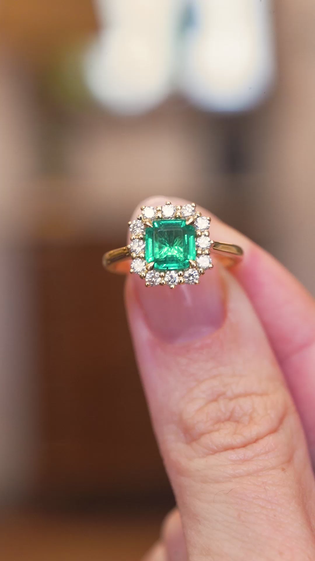 Antique-inspired, emerald and diamond cluster engagement ring