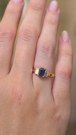 A video of vintage 1960s sapphire and diamond engagement ring worn on the hand.