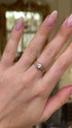 antique victorian diamond solitaire engagement ring worn on hand and moved around to give perspective.