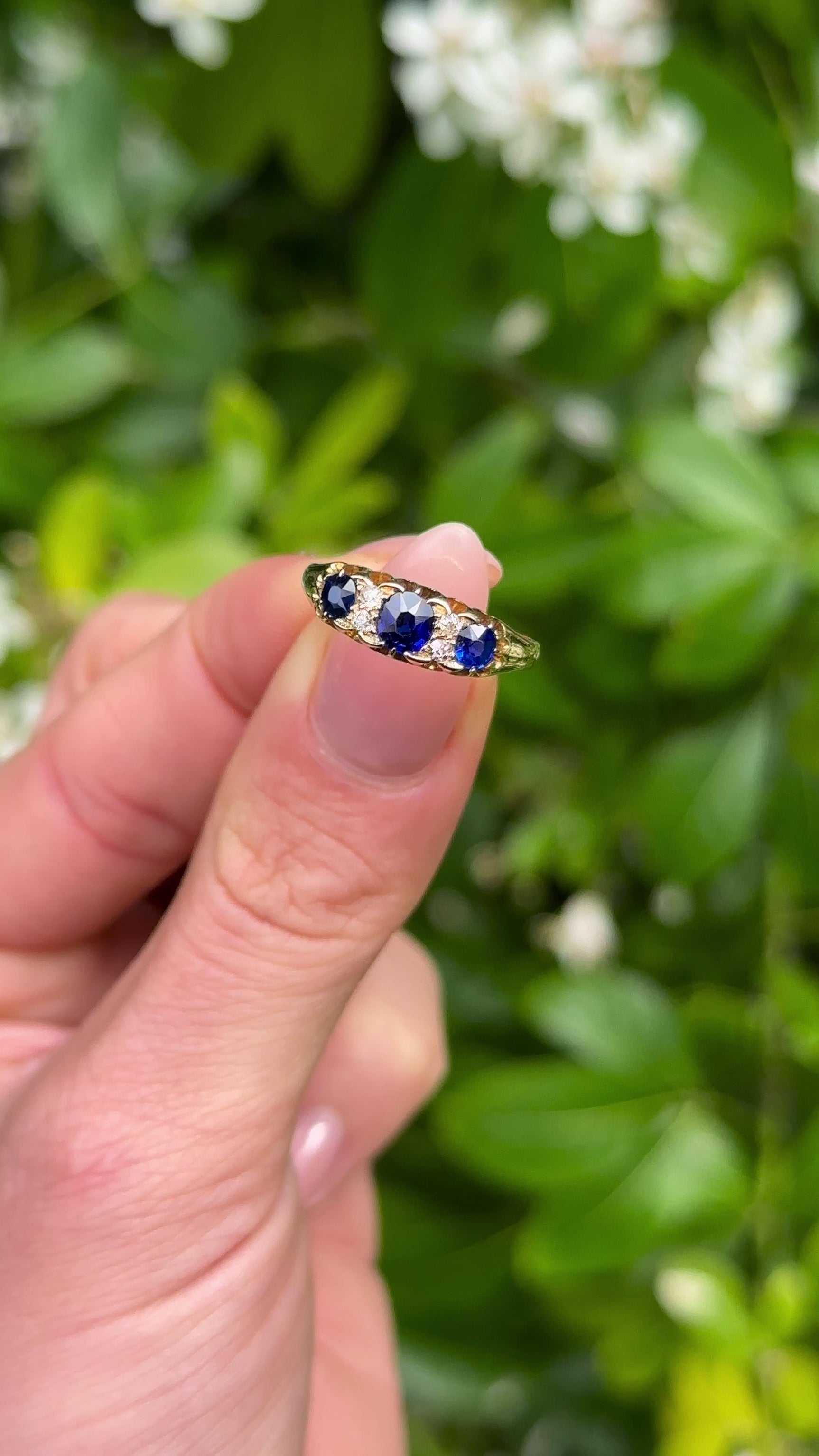 Antique, Victorian Sapphire and Diamond Three-Stone Ring, 18ct Yellow Gold held in fingers.
