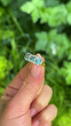 1930s Zircon and Diamond Three Stone Cluster Ring, 18ct Yellow Gold & Platinum held in fingers.