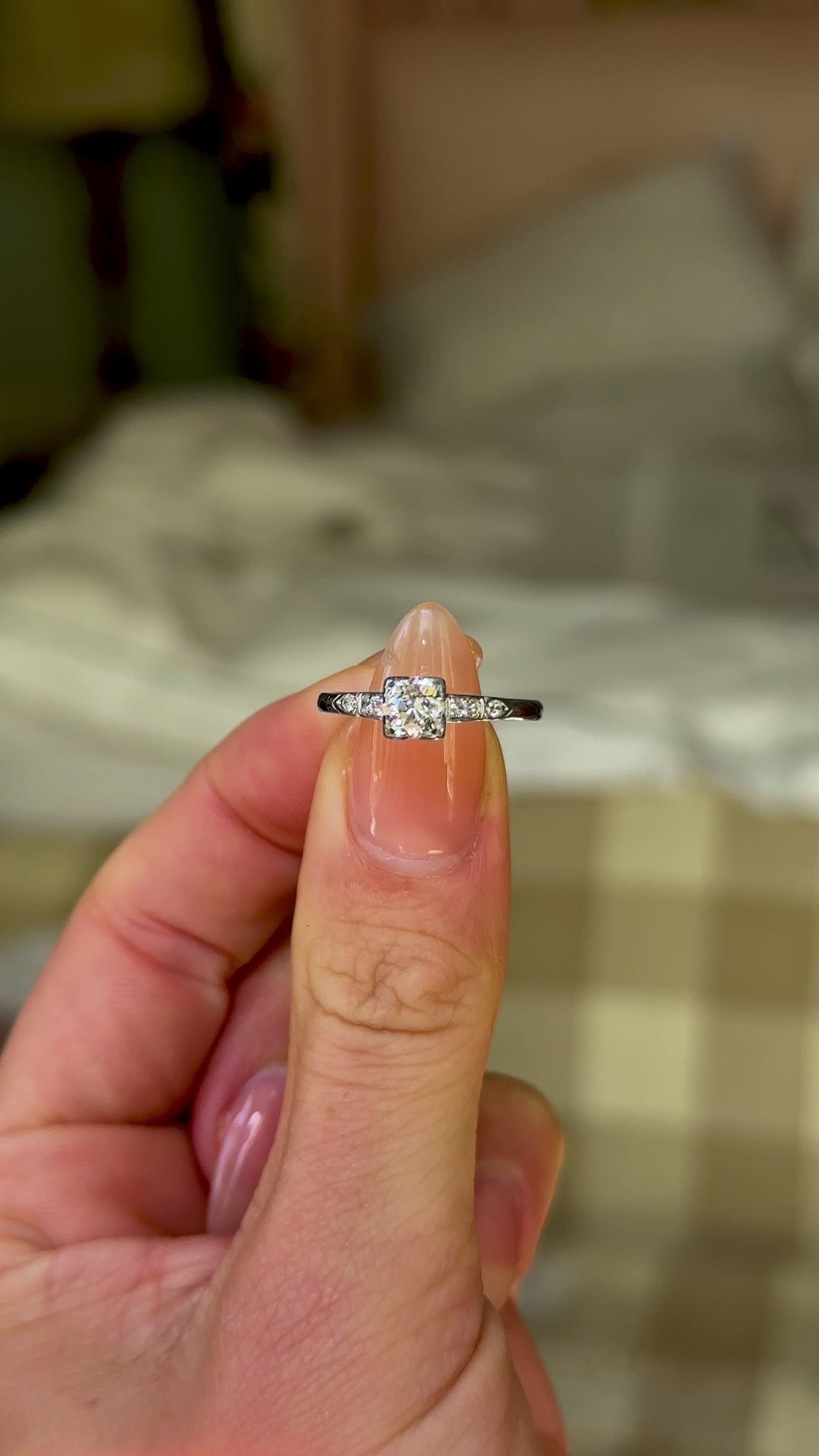 Vintage, Art Deco Diamond Engagement Ring, Platinum and Iridium held in fingers and rotated to give perspective.