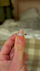 Vintage, Art Deco Diamond Engagement Ring, Platinum and Iridium held in fingers and rotated to give perspective.