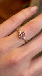 Pink sapphire and diamond three-stone engagement ring