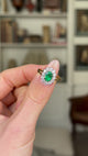 Vintage, Emerald and Diamond Cluster Ring, 18ct Yellow Gold & Platinum held in fingers and rotated to give perspective.