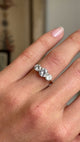 A video of an Antique, Edwardian old-cut diamond three-stone ring worn on a wedding finger. 