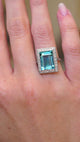 A video of an antique Art Deco aquamarine and diamond cocktail ring in platinum worn on the hand.
