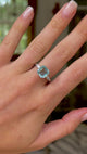 vintage aquamarine and diamond ring worn on hand and moved around to give perspective. 
