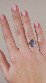 A video of the antique-inspired sapphire ring being worn, capturing the gemstone's shifting blue and violet tones.