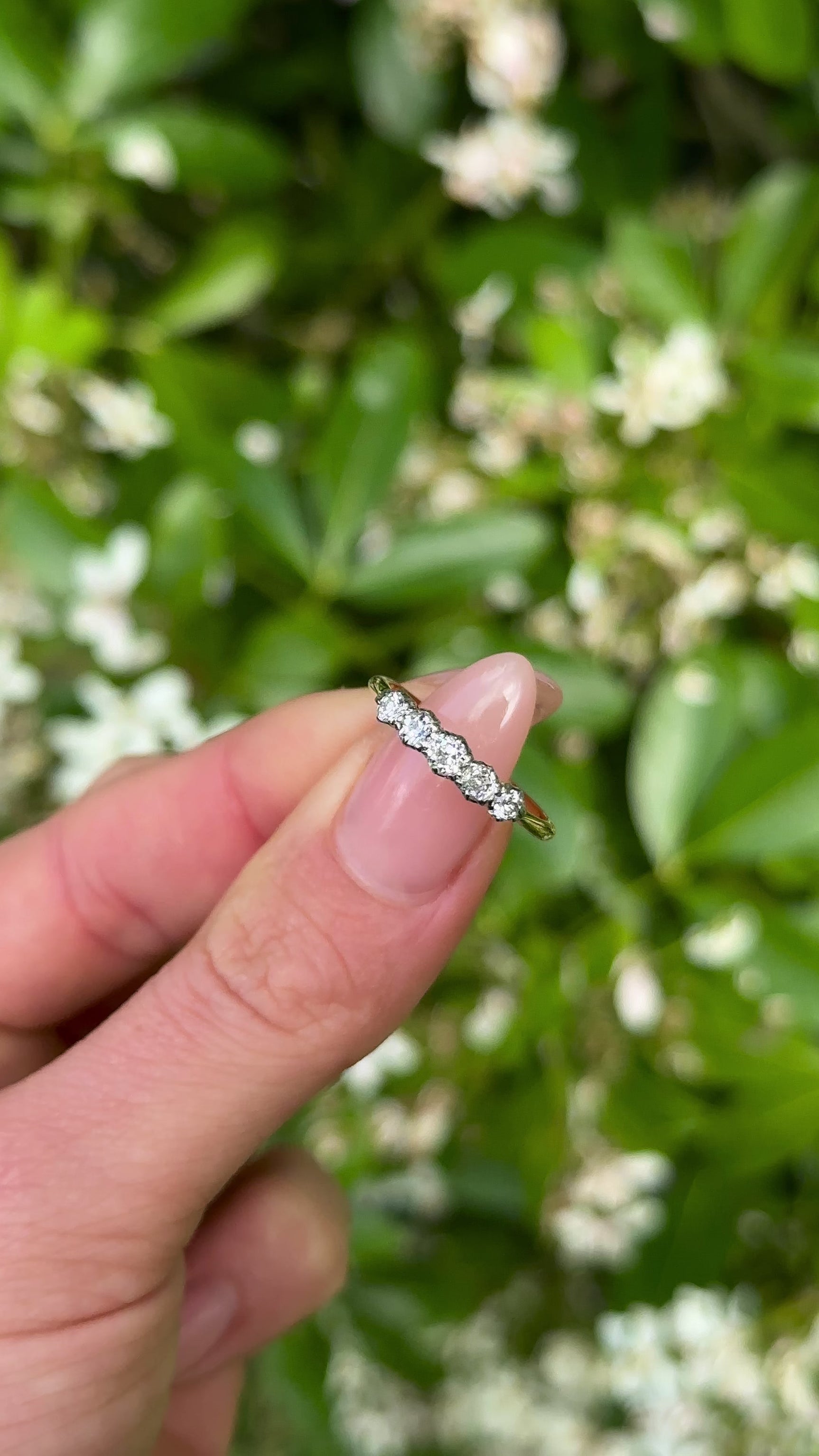 Antique, Edwardian Five-Stone Diamond Ring, 18ct Yellow Gold held in fingers.