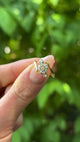 Vintage, Diamond Cluster Engagement Ring, 18ct Yellow Gold held in fingers.