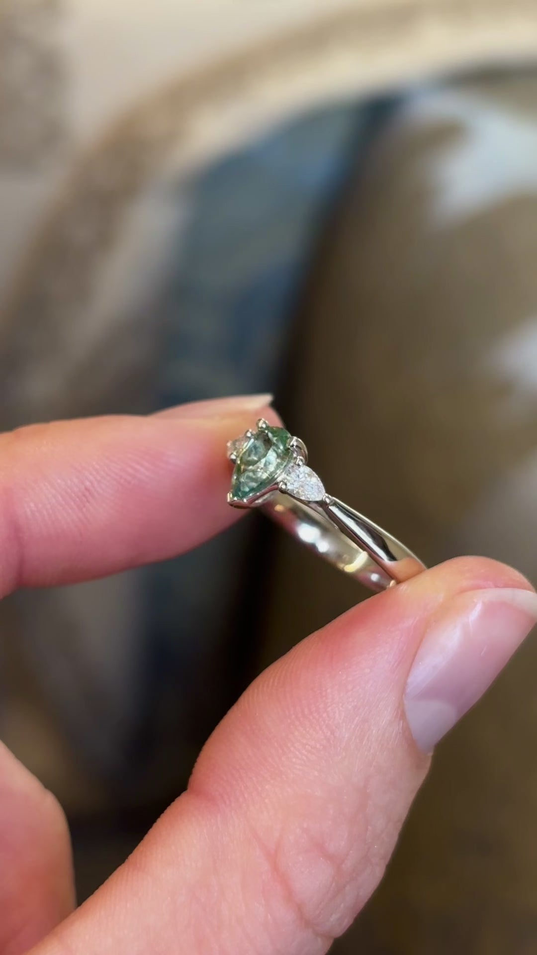 Pear-cut teal sapphire & diamond three-stone engagement ring