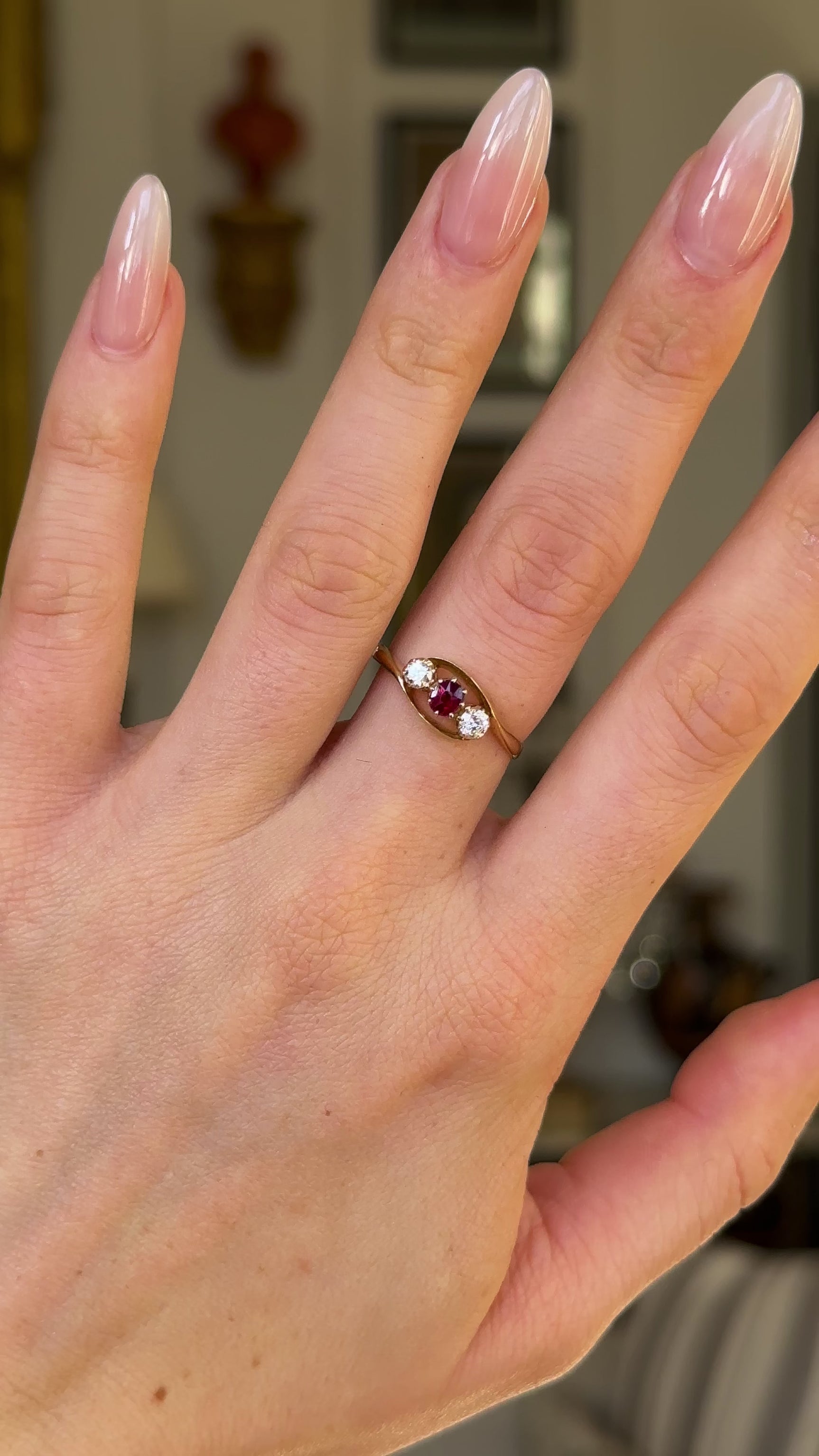 Antique, Three-Stone Ruby and Diamond Engagement Ring, 18ct Yellow Gold worn on hand and rotated to give perspective.