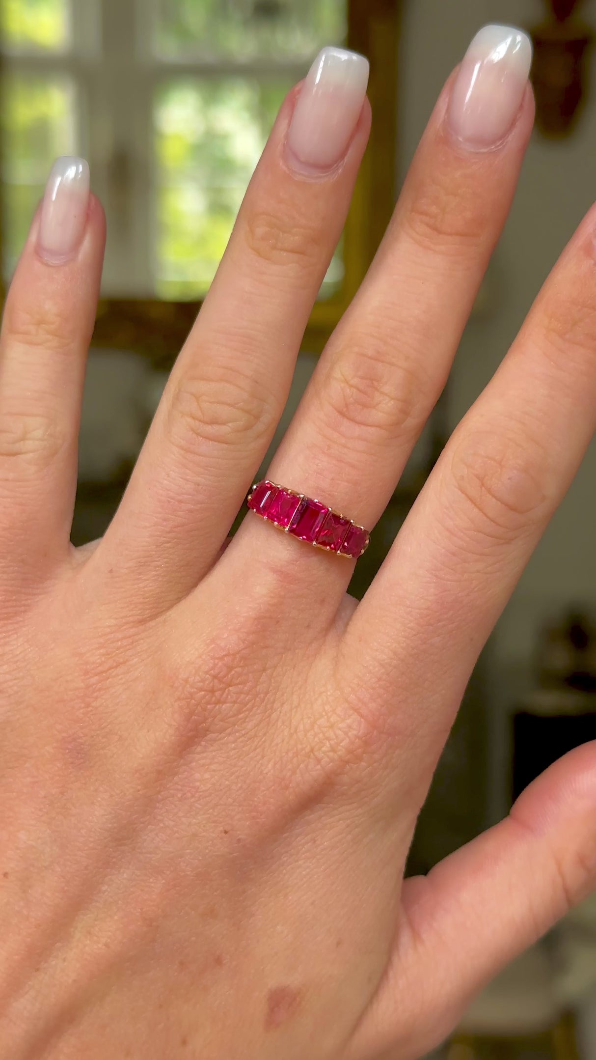 Antique spinel half hoop ring, worn on hand and moved around to give perspective. 